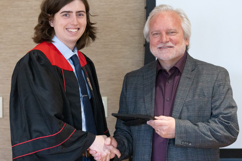Jeff Johnson and a PharmTox graduate pose for a photo.