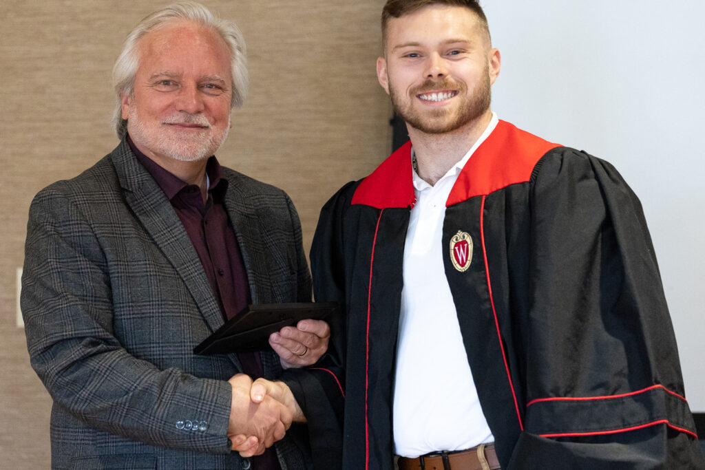 Jeff Johnson and a PharmTox graduate pose for a photo.