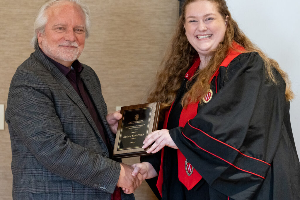 Kegan Skalitzy and Jeff Johnson pose with her award.