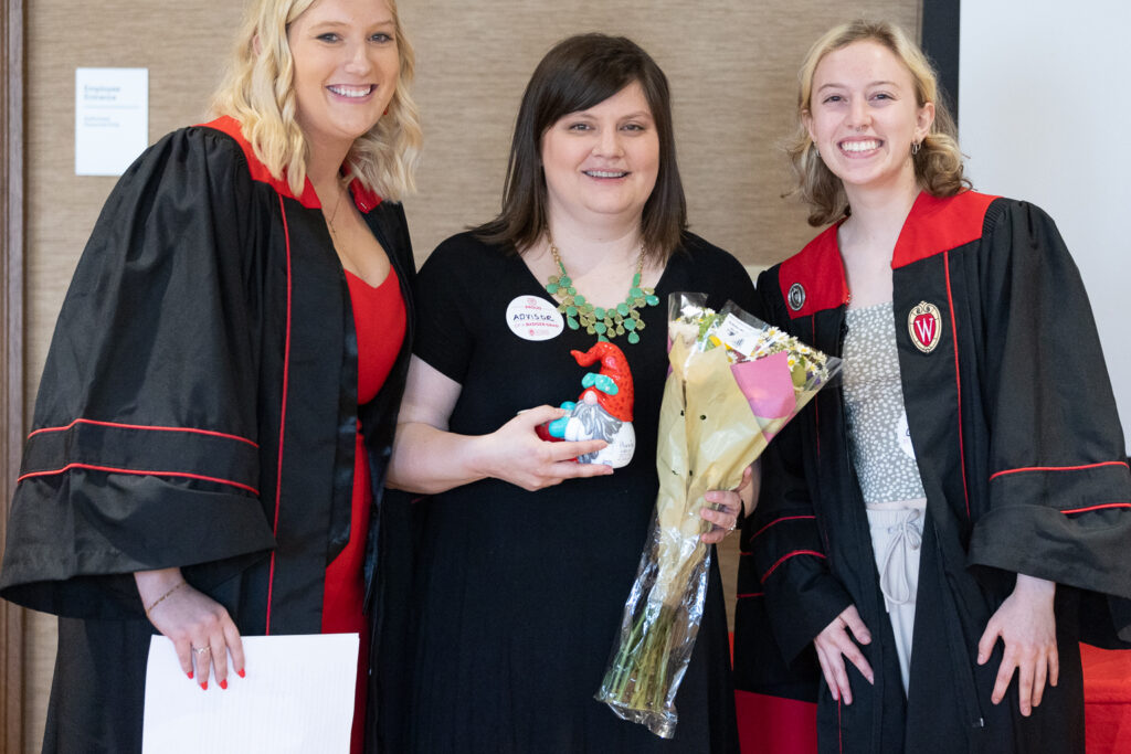 Two PharmTox graduates pose with Kendra Gurnee.