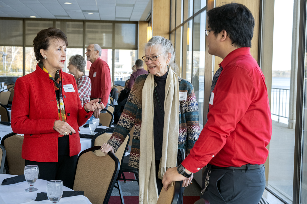 Peggy Wiederholt speaking to Betty Chewning and Steven Do