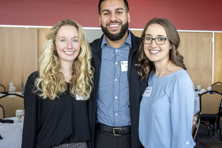 Carley Laffin, Amrit Kumar, and Tegan Quinn standing together smiling