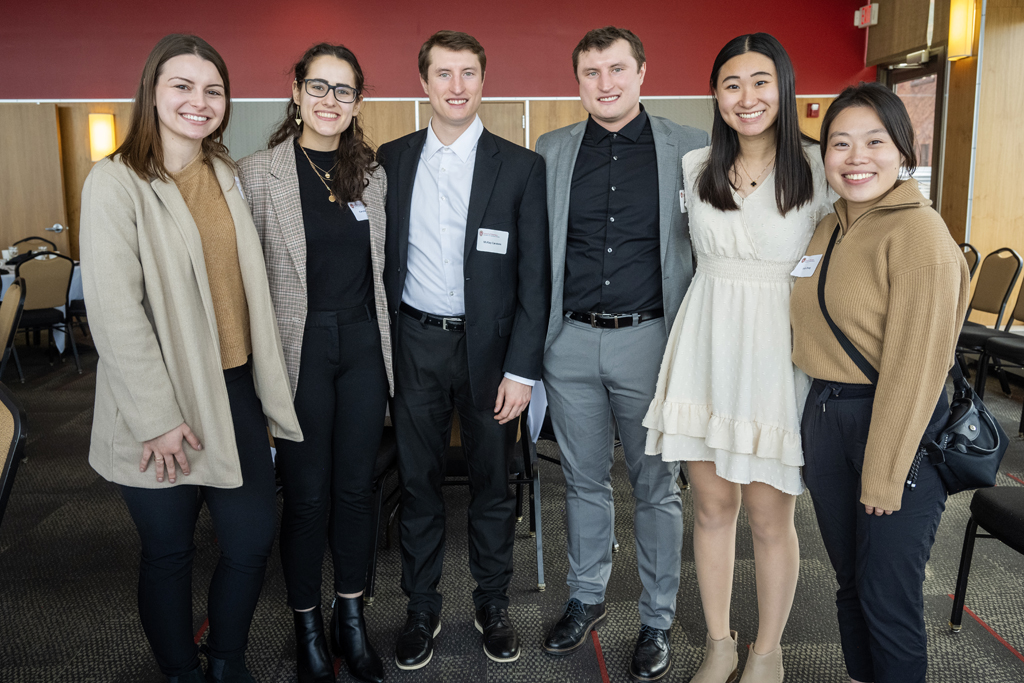 PharmD students smiling arm-in-arm together