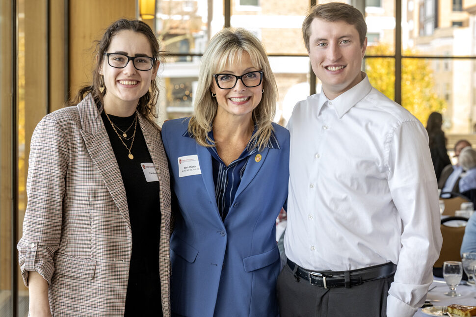 Beth Martin standing in between Caroline Paley and McKay Carstens