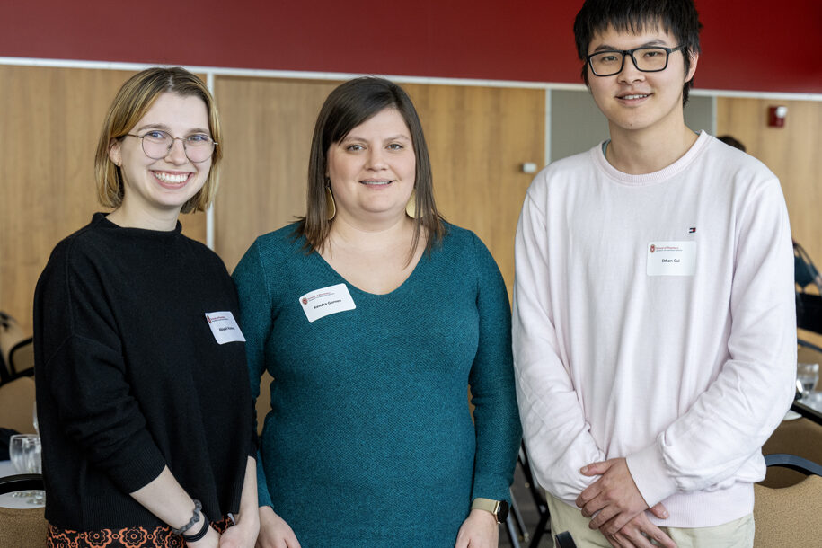 Kendra Gurnee standing in between Abigail Komro and Ethan Cui smiling