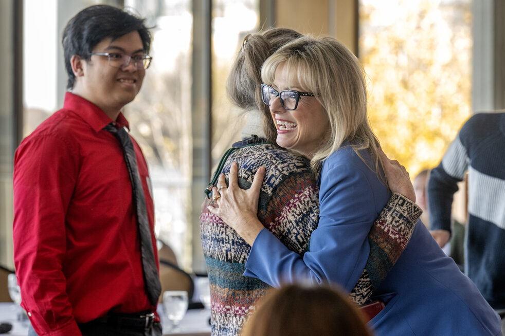 Beth Martin smiling and embracing Betty Chewning