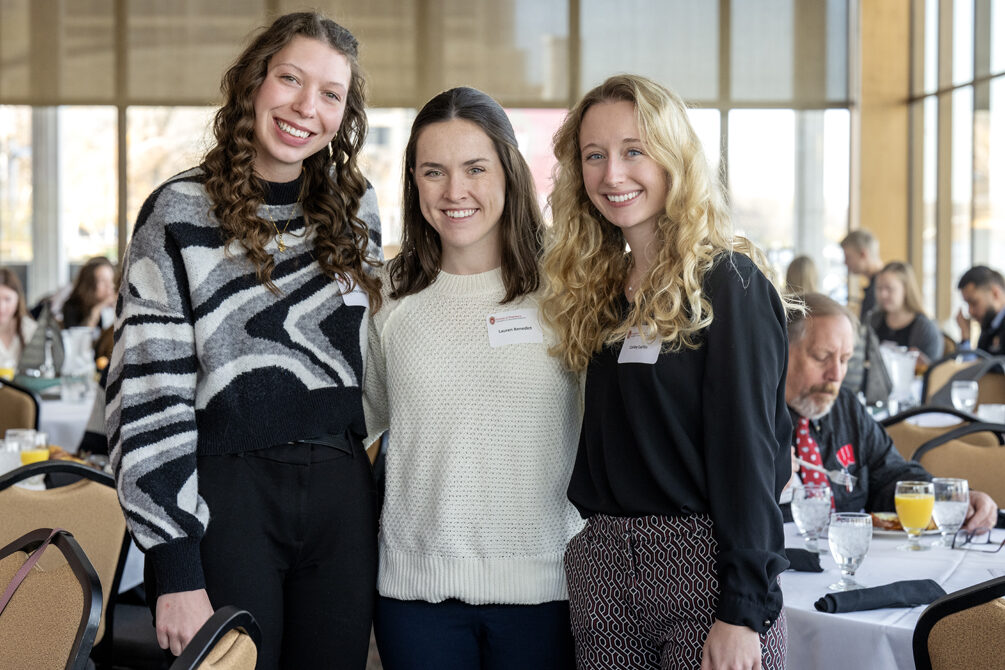 Sierra Szymanski, Lauren Benedict, and Carley Laffin standing together for picture smiling