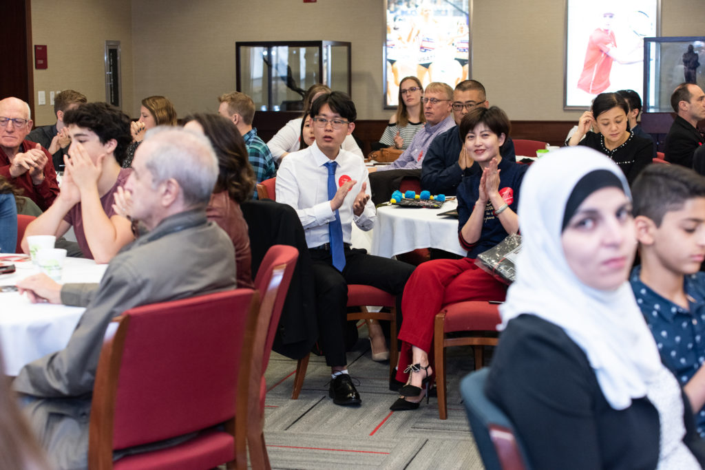 Students with their family and friends enjoy the breakfast ceremony.