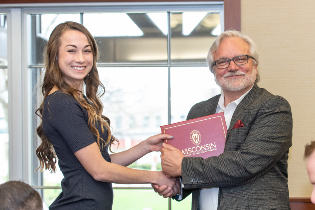 Students receive their diploma from Professor Jeff Johnson.