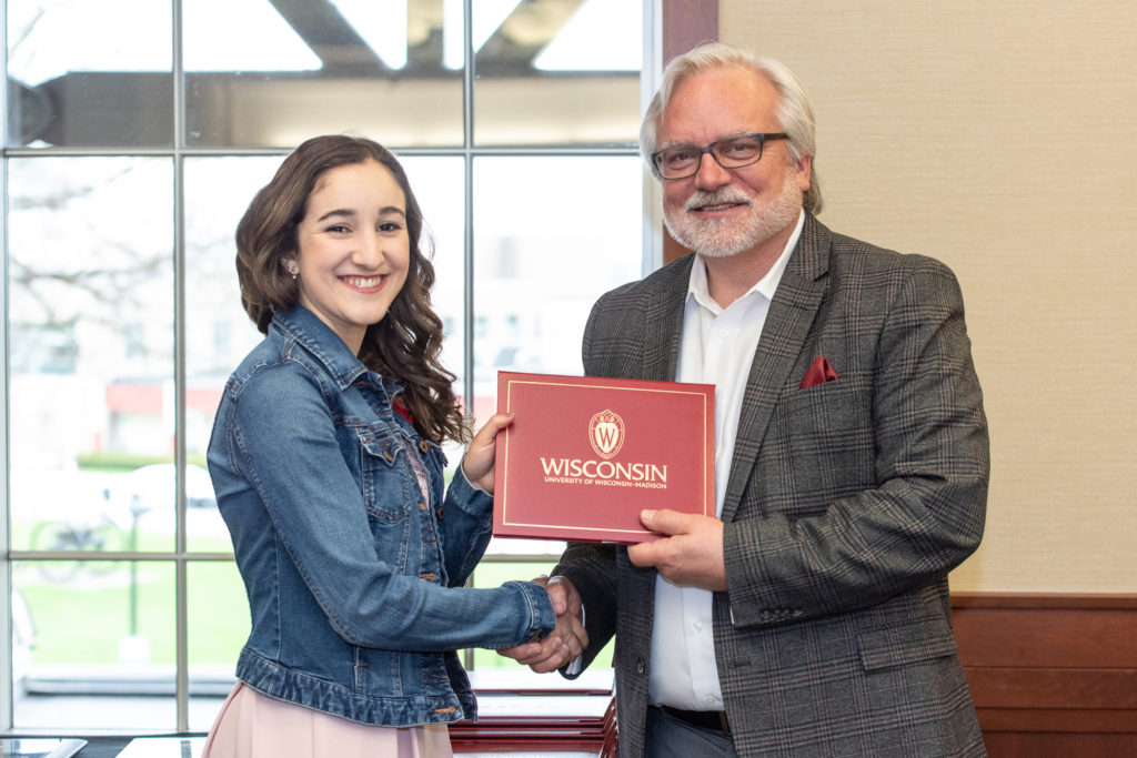 Students receive their diploma from Professor Jeff Johnson.