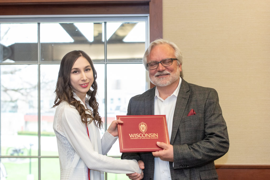 Students receive their diploma from Professor Jeff Johnson.