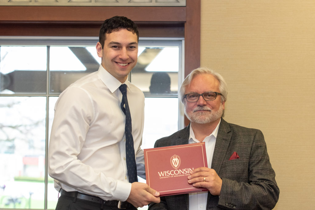 Students receive their diploma from Professor Jeff Johnson.