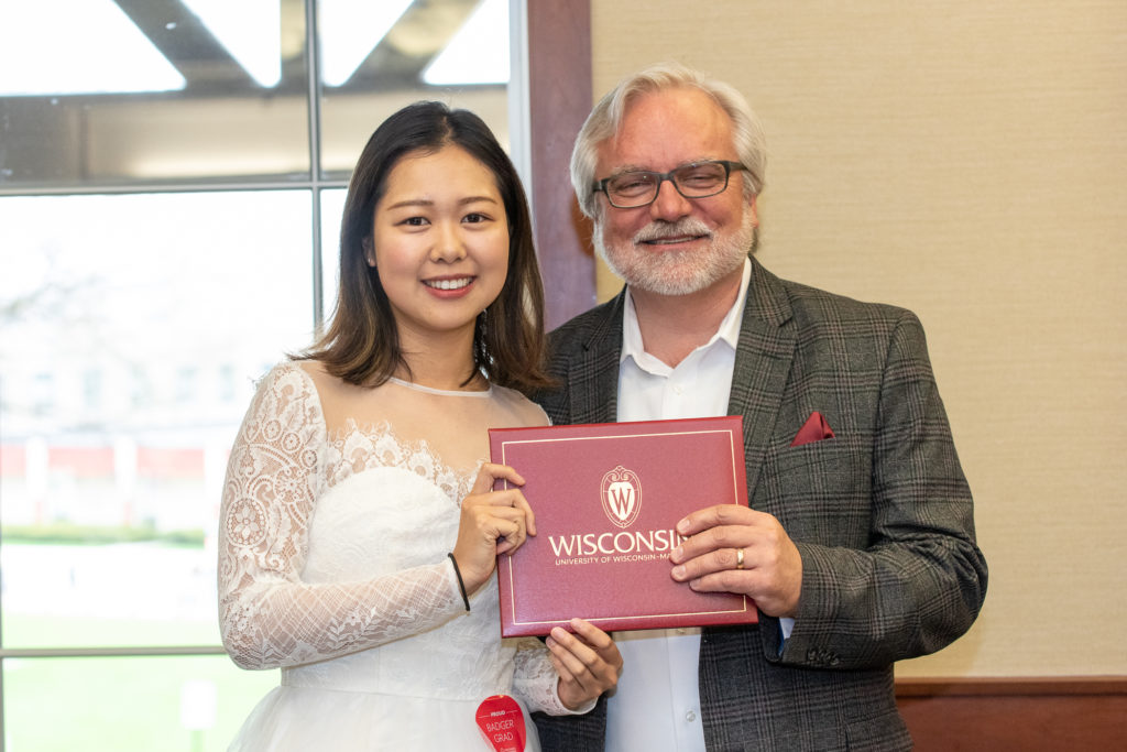 Students receive their diploma from Professor Jeff Johnson.