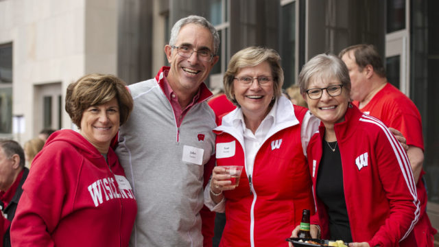 Alumni catching up at the UW-Madison Pharmacy Alumni Tailgate event, held at Union South during the Badgers vs. Cornhuskers game.