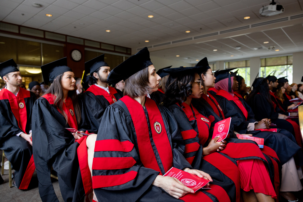 Graduates listen to speakers
