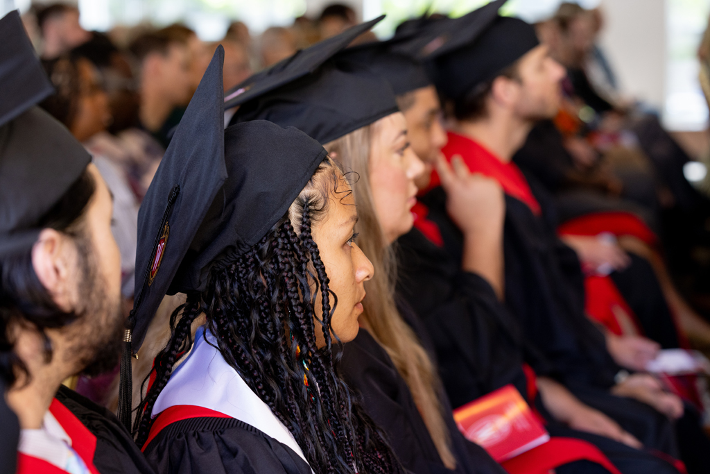 Graduates listen to speakers
