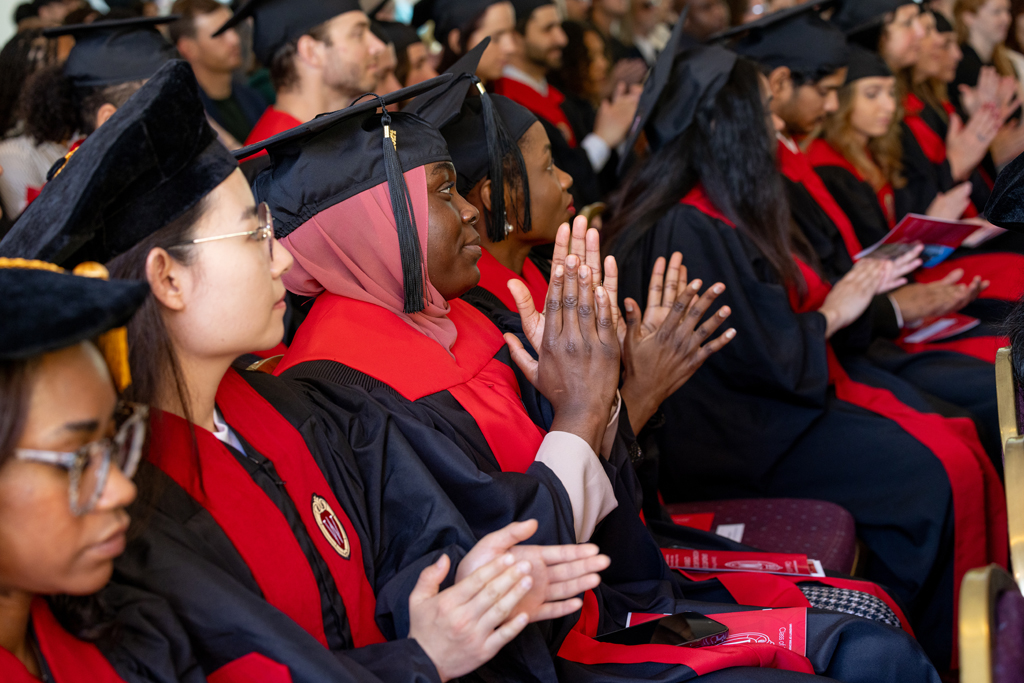 Graduates listen to speakers