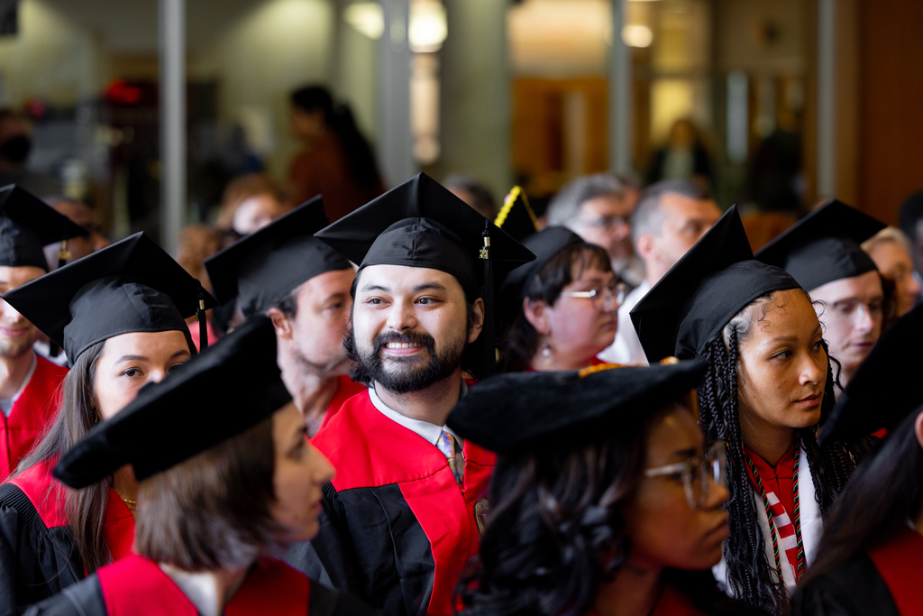 Graduates listen to speakers