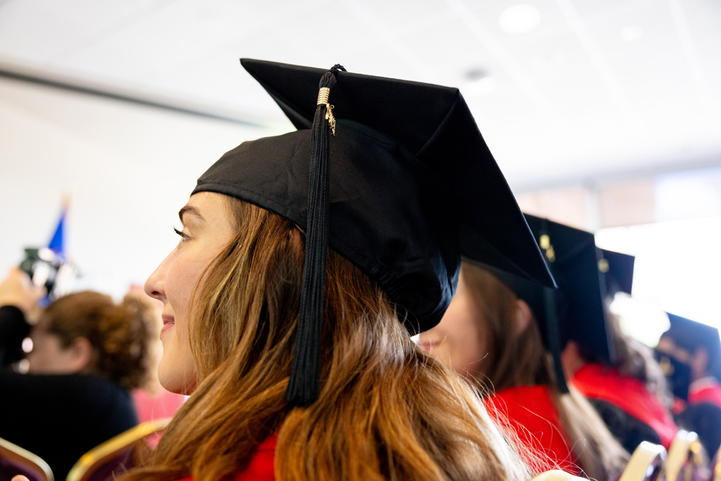 Graduates listen to speakers