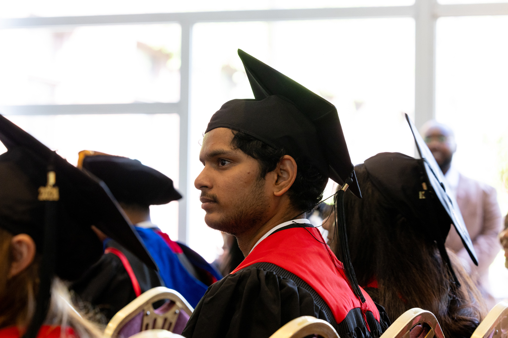 Graduates listen to speakers