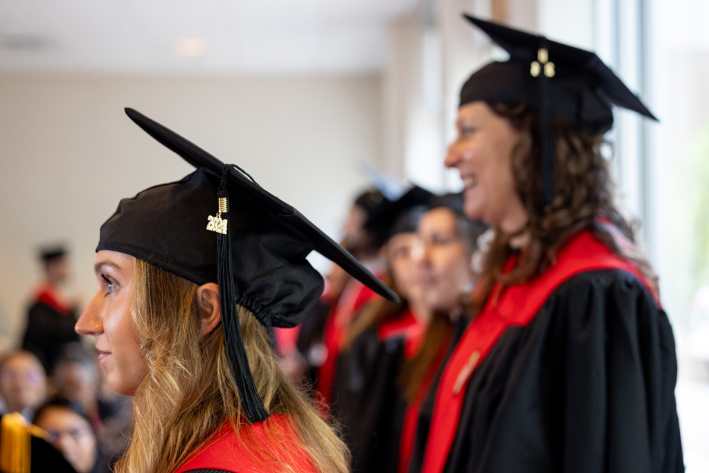 Graduates listen to speakers