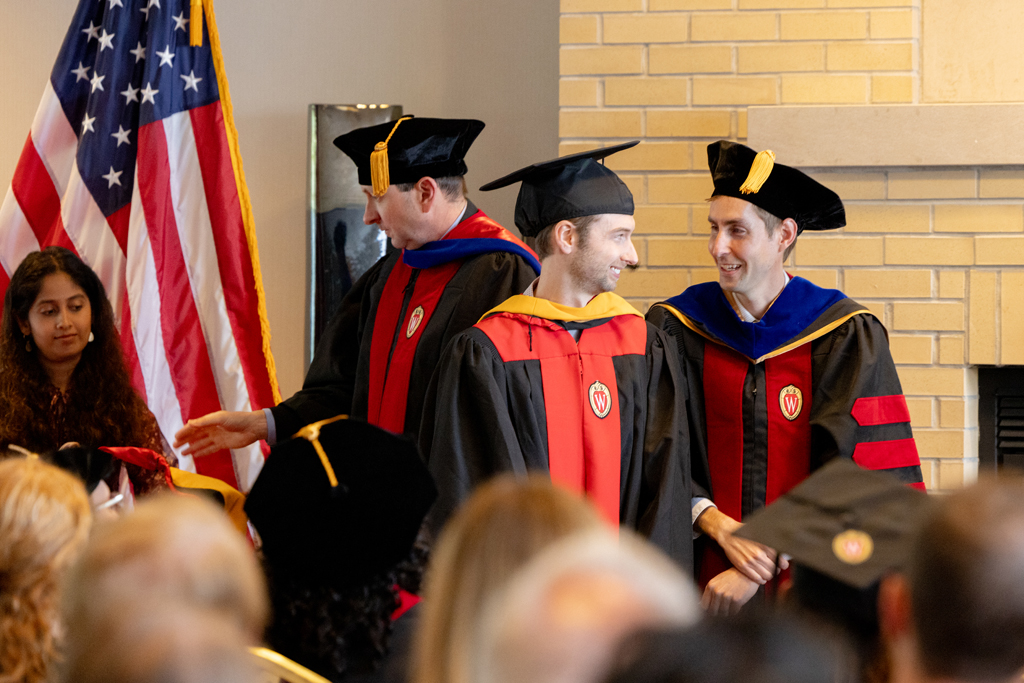 A graduate receives his hood