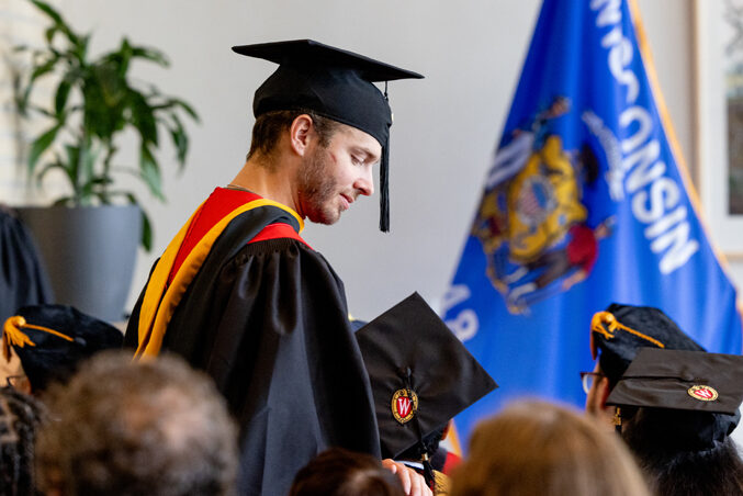A graduate finds his seat