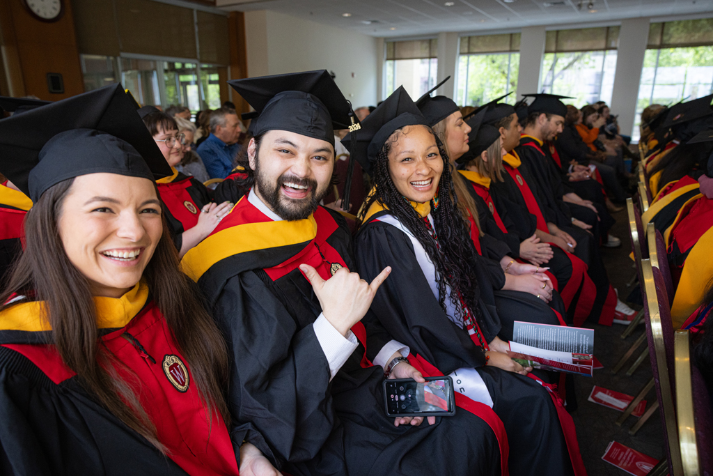 Graduates smile excitedly