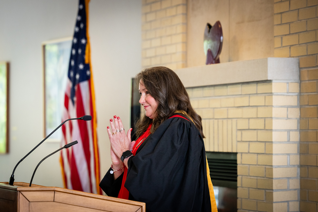 Lindy Stoll speaks at the podium