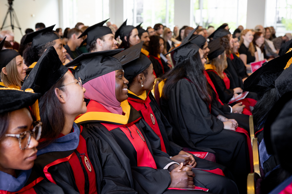 Graduates listen to the speakers