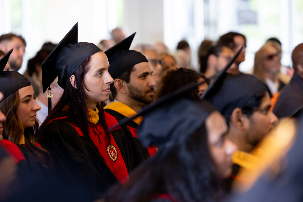 Graduates listen to the speakers