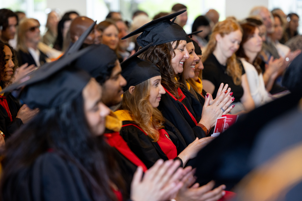 Graduates listen to the speakers