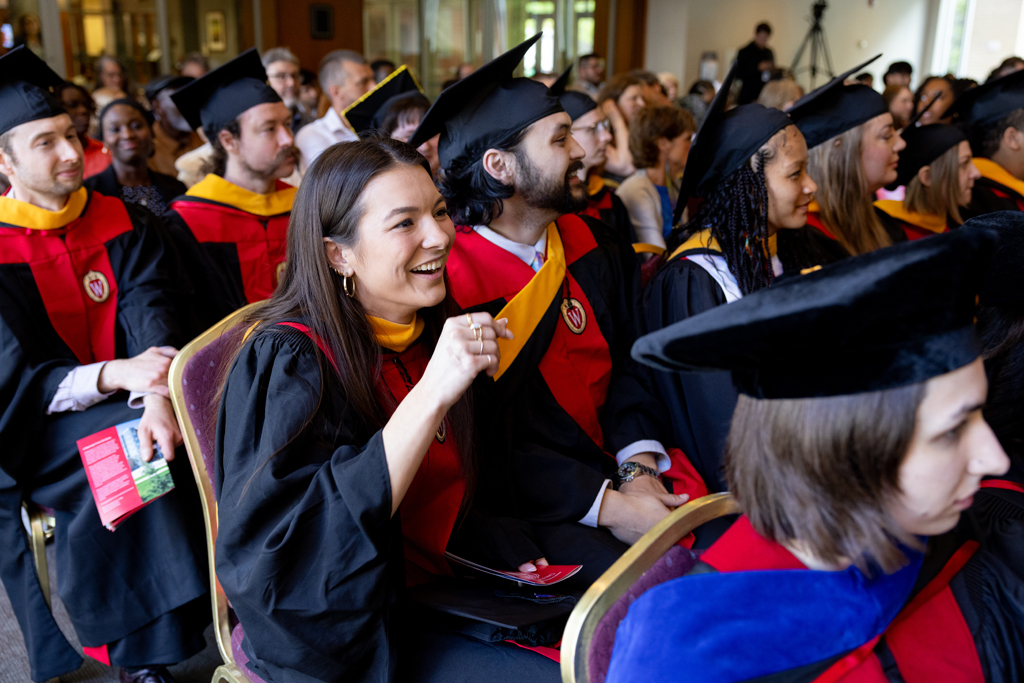 Graduates listen to the speakers