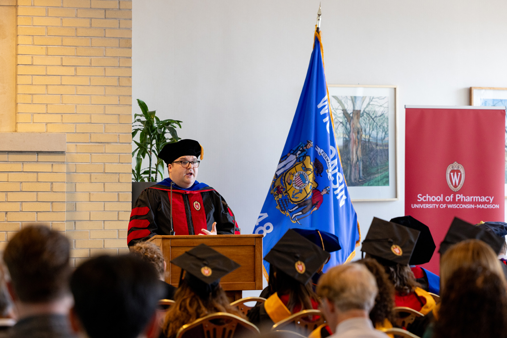 Jason Chladek speaks at the podium