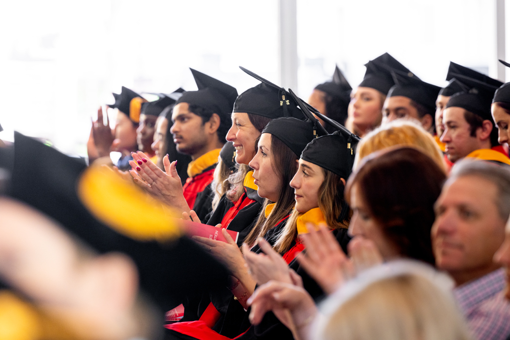 Graduates listen to the speakers