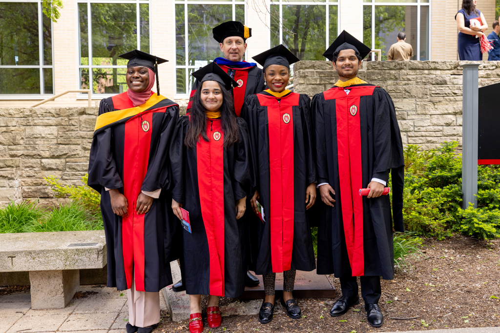 Applied Drug Development graduates pose with Associate Professor Eric Buxton