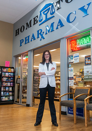 A preceptor stands outside HomeTown Pharmacy in Beaver Dam