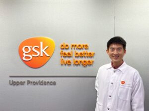 Rattavut Teerakapibal in front of GSK signage