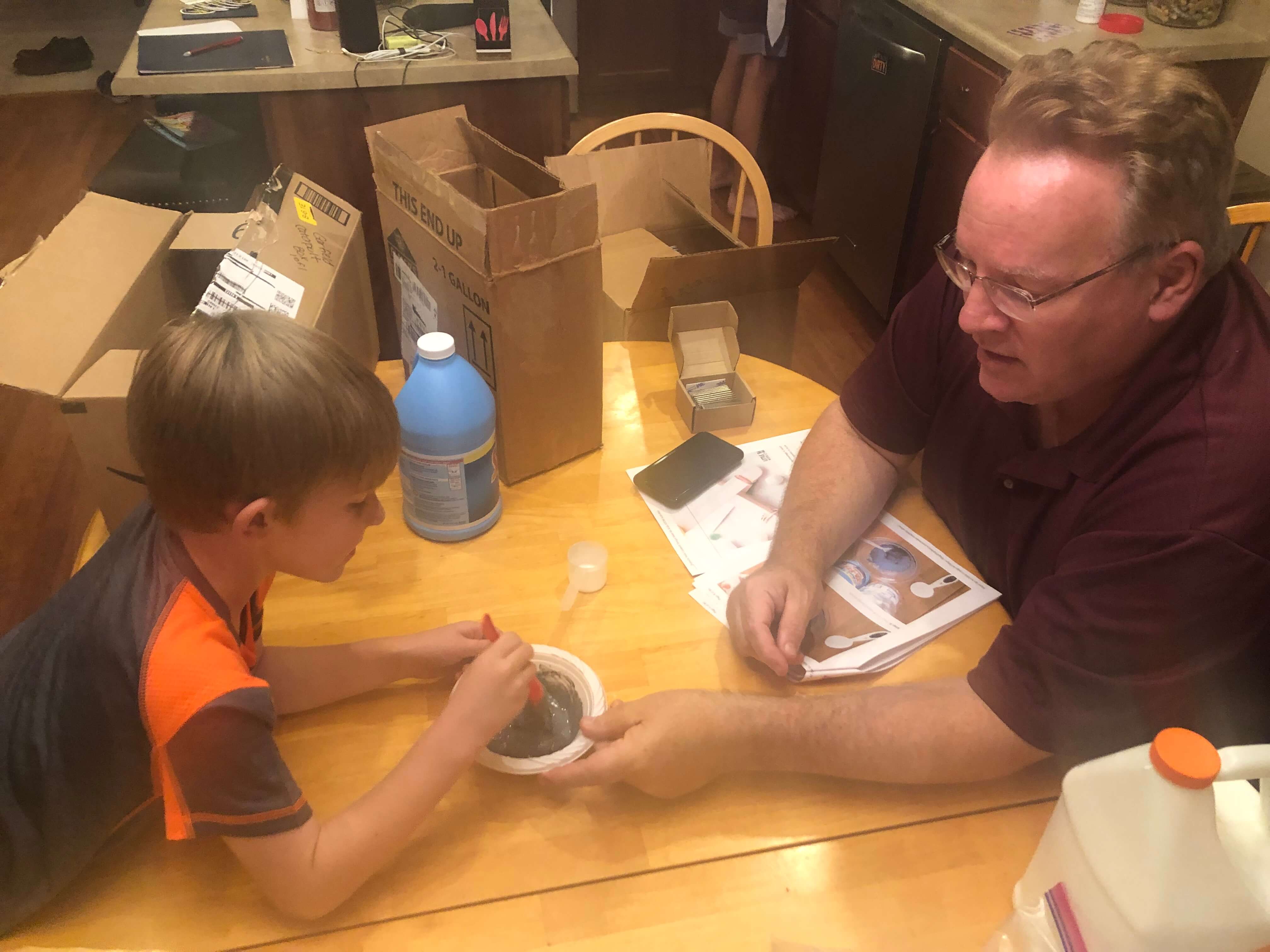 Robert Jolly teaching a science lesson to a child