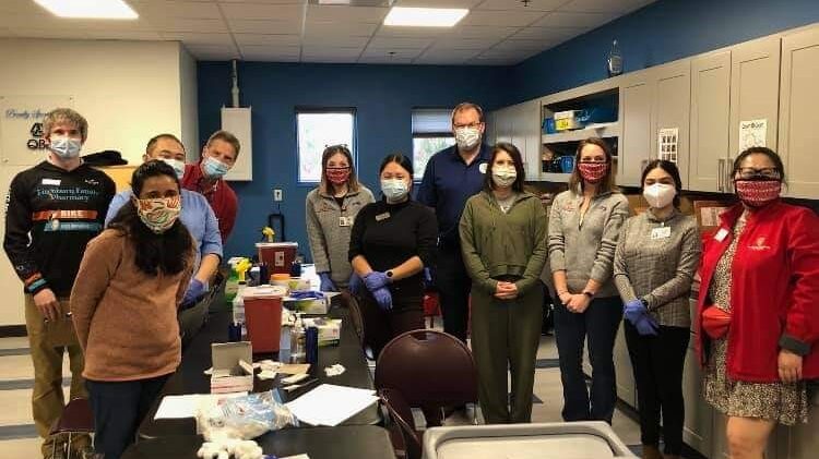 School of pharmacy volunteers at vaccination clinic at Boys & Girls Sun Prairie Club