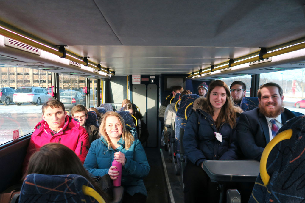 Students sitting inside of Badger Coaches bus