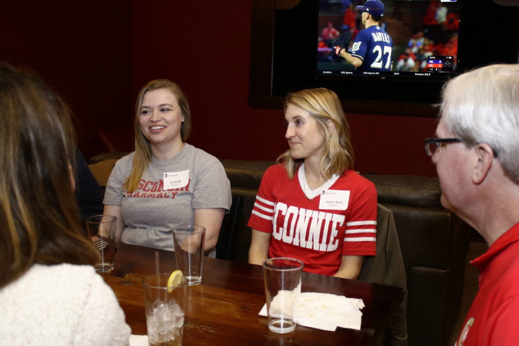 Many alumni participate in conversation.