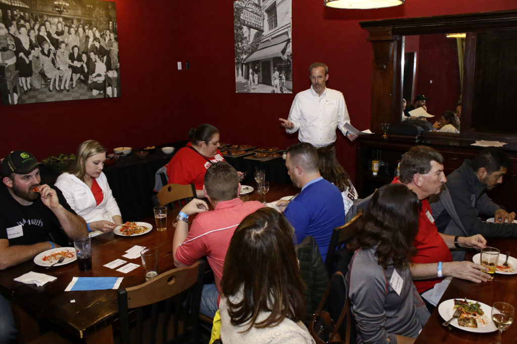 Professor David Mott leads the discussion among alumni.