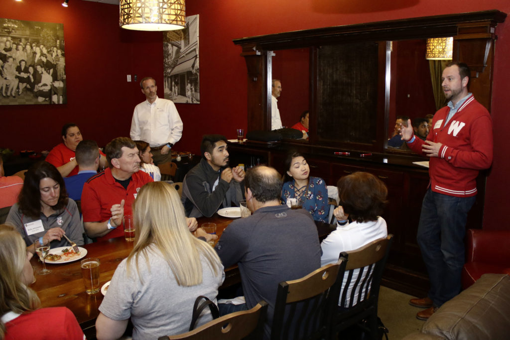 Professor David Mott leads the discussion among alumni and engages them all.