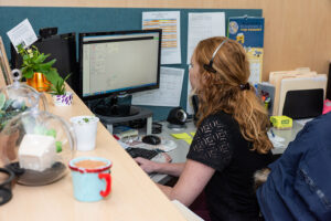 Heather Stoner working at her computer