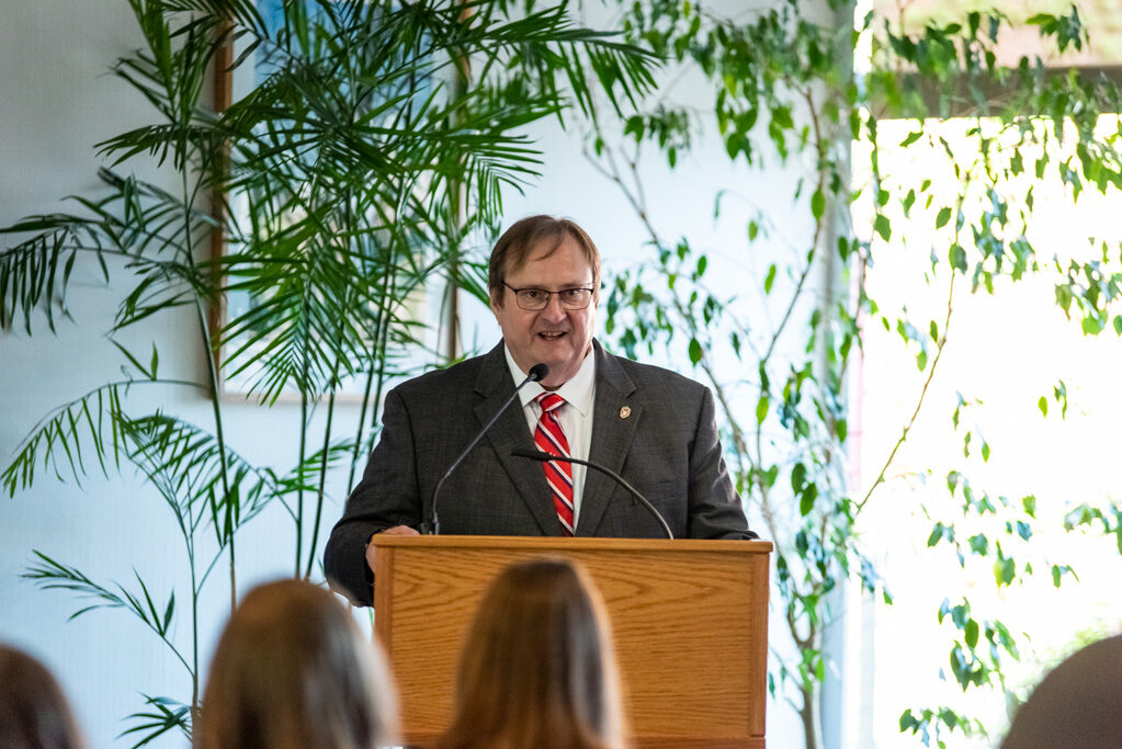 Steve Swanson speaking at the podium