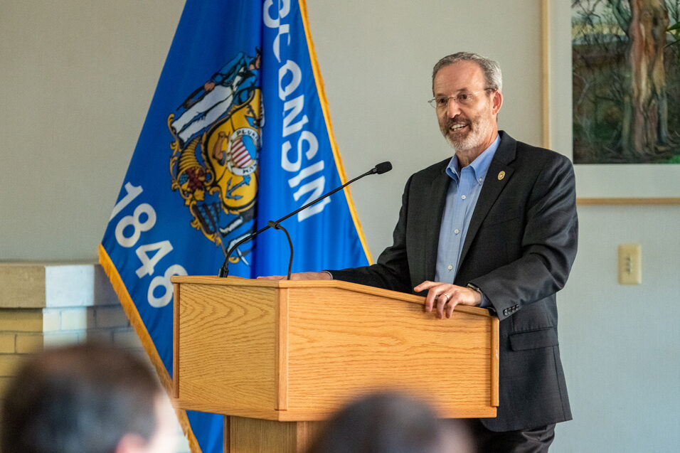 Dave Mott speaking at the podium