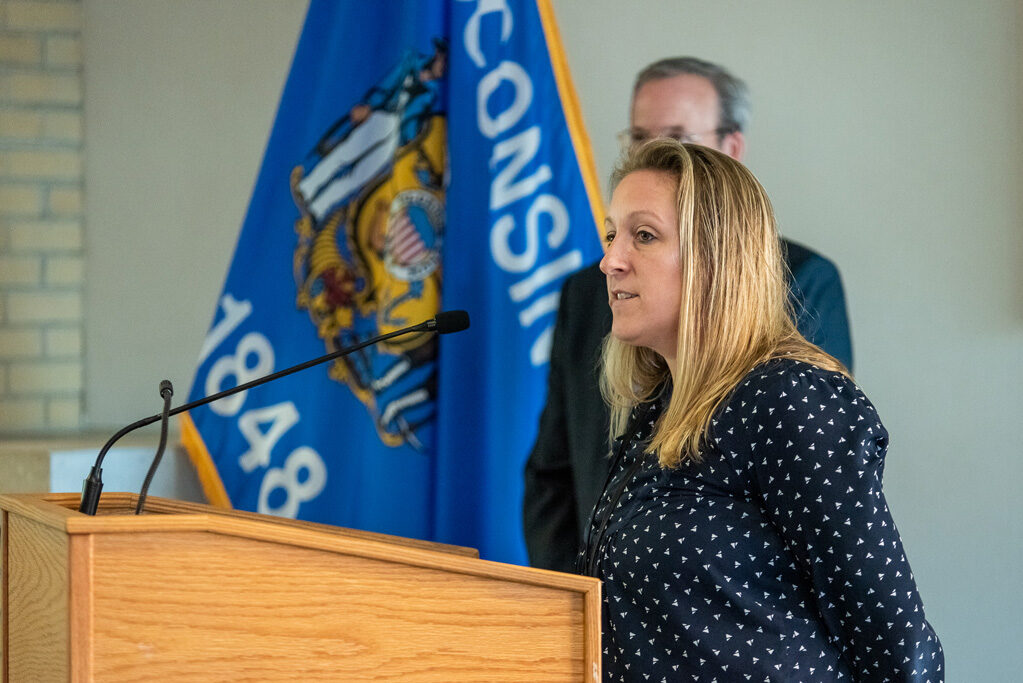 Faculty member speaking at podium