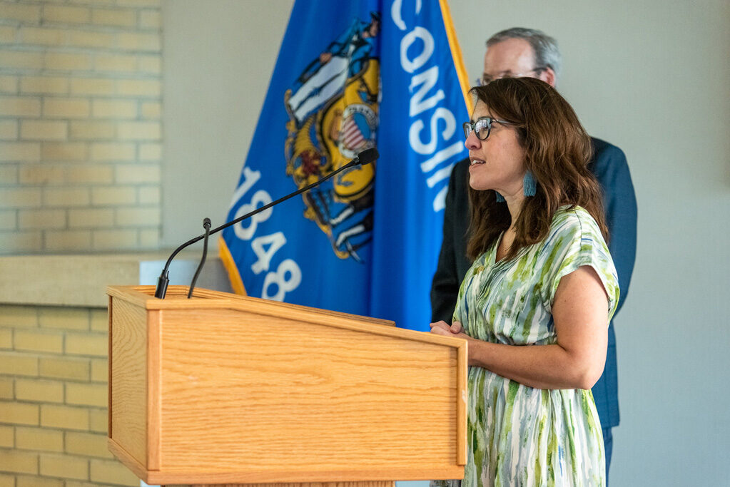 Faculty member speaking at podium