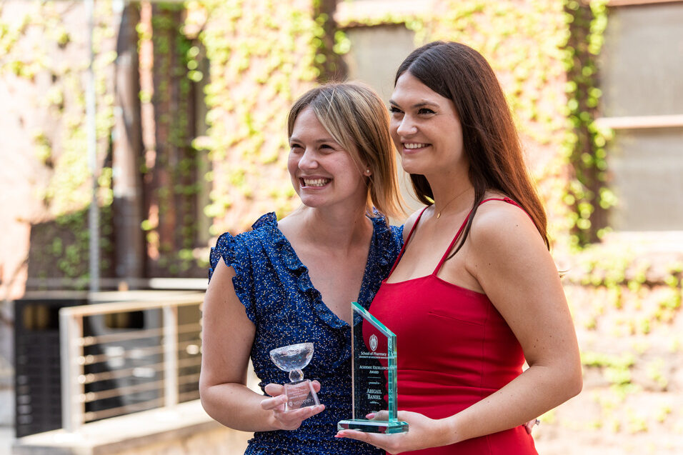 UW Pharm Award recipients holding their awards